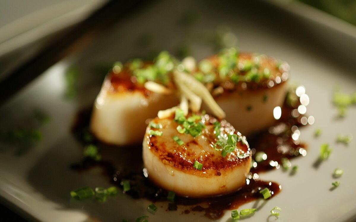 Seared scallops with ponzu, ginger and chives