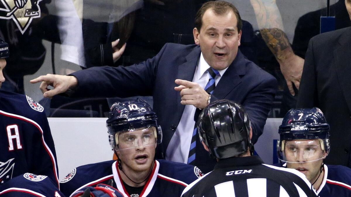 Todd Richards talks with an official during a Blue Jackets game against the Penguins on Dec. 13, 2014.