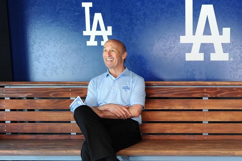 LOS ANGEL;ES, CALIFORNIA APRIL 7, 2021-Dodgers president Stan Kasten sits in a photo booth.