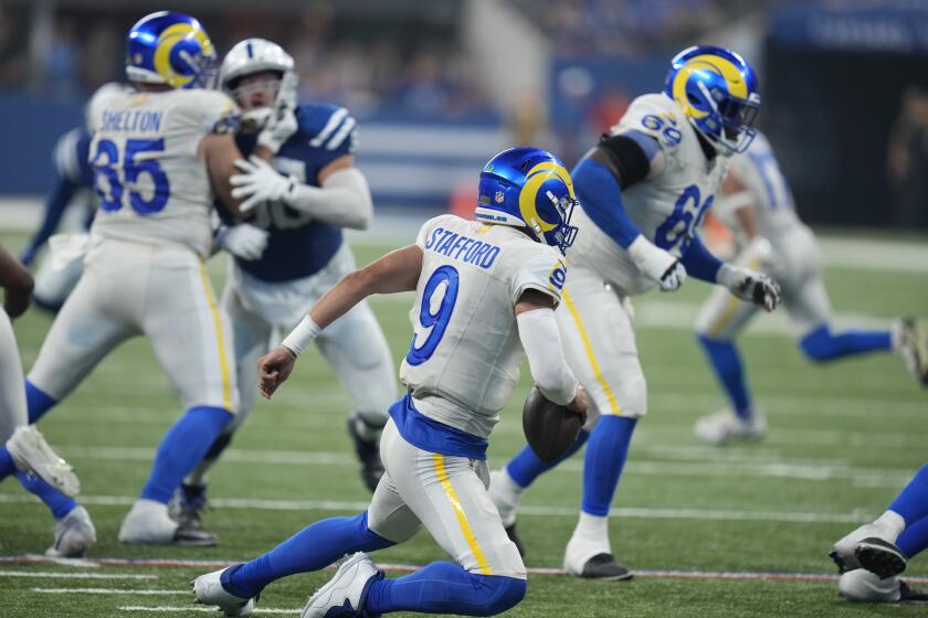 Rams quarterback Matthew Stafford stumbles to the ground against the Colts.