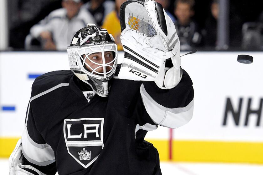 Kings goaltender Jhonas Enroth defects a shot during the third period of a preseason game against the Ducks on Sept. 29.