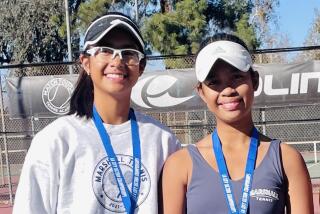 Marshall sisters Johanna (left) and Julianna Galindo after the LA City Section girls' tennis finals last Wednesday.