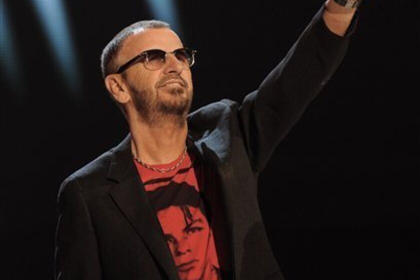 Ringo Starr is seen on stage as he announces the nominees for record of the year at the Grammy Nominations Concert on Wednesday, Dec. 2, 2009, in Los Angeles. (AP Photo/Chris Pizzello)