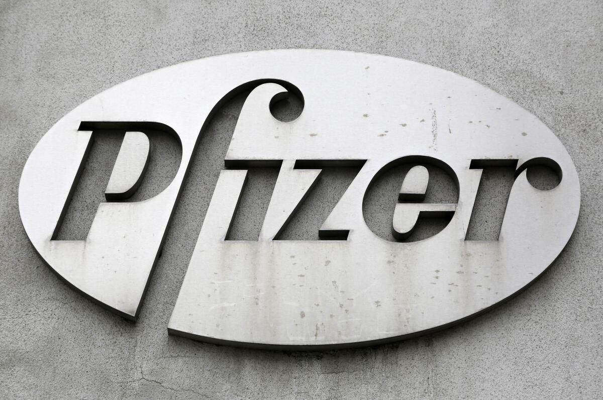 FILE - The Pfizer logo is displayed on the exterior of a former Pfizer factory, on May 4, 2014, in the Brooklyn borough of New York. Pfizer is buying sickle cell drug maker Global Blood Therapeutics in an approximately $5.4 billion deal as it looks to accelerate growth after its revenue soared during the pandemic. Both companies' boards have approved the deal, which still needs regulatory approval and approval from GBT shareholders. (AP Photo/Mark Lennihan, File)
