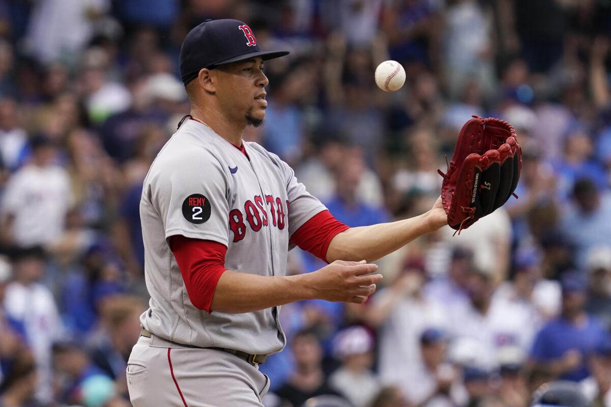 Boston Red Sox relief pitcher Hansel Robles reacts as he tosses the ball.