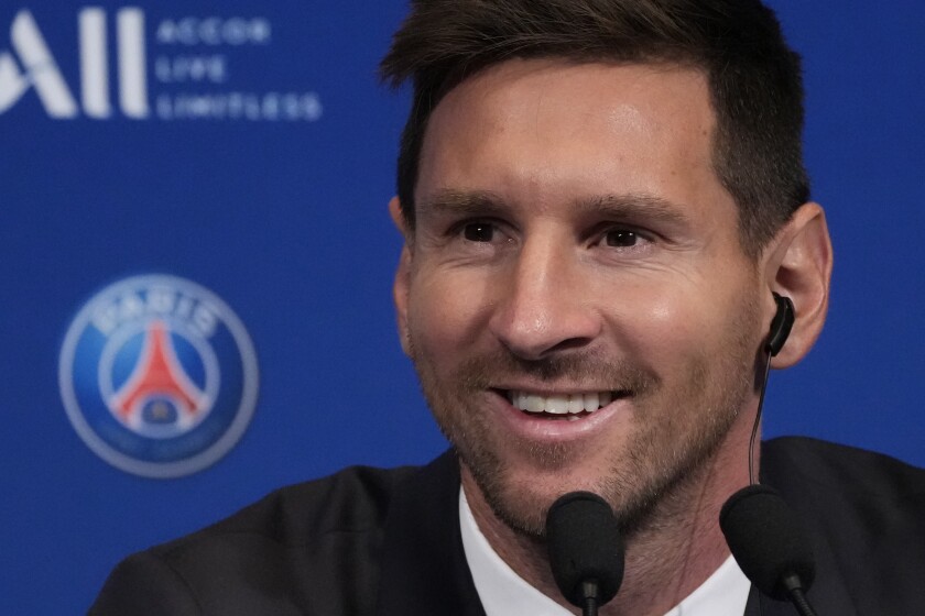 Lionel Messi attends a press conference Wednesday, Aug. 11, 2021 at the Parc des Princes stadium in Paris. Lionel Messi said he's been enjoying his time in Paris "since the first minute" after he signed his Paris Saint-Germain contract on Tuesday night. The 34-year-old Argentina star signed a two-year deal with the option for a third season after leaving Barcelona. (AP Photo/Francois Mori)