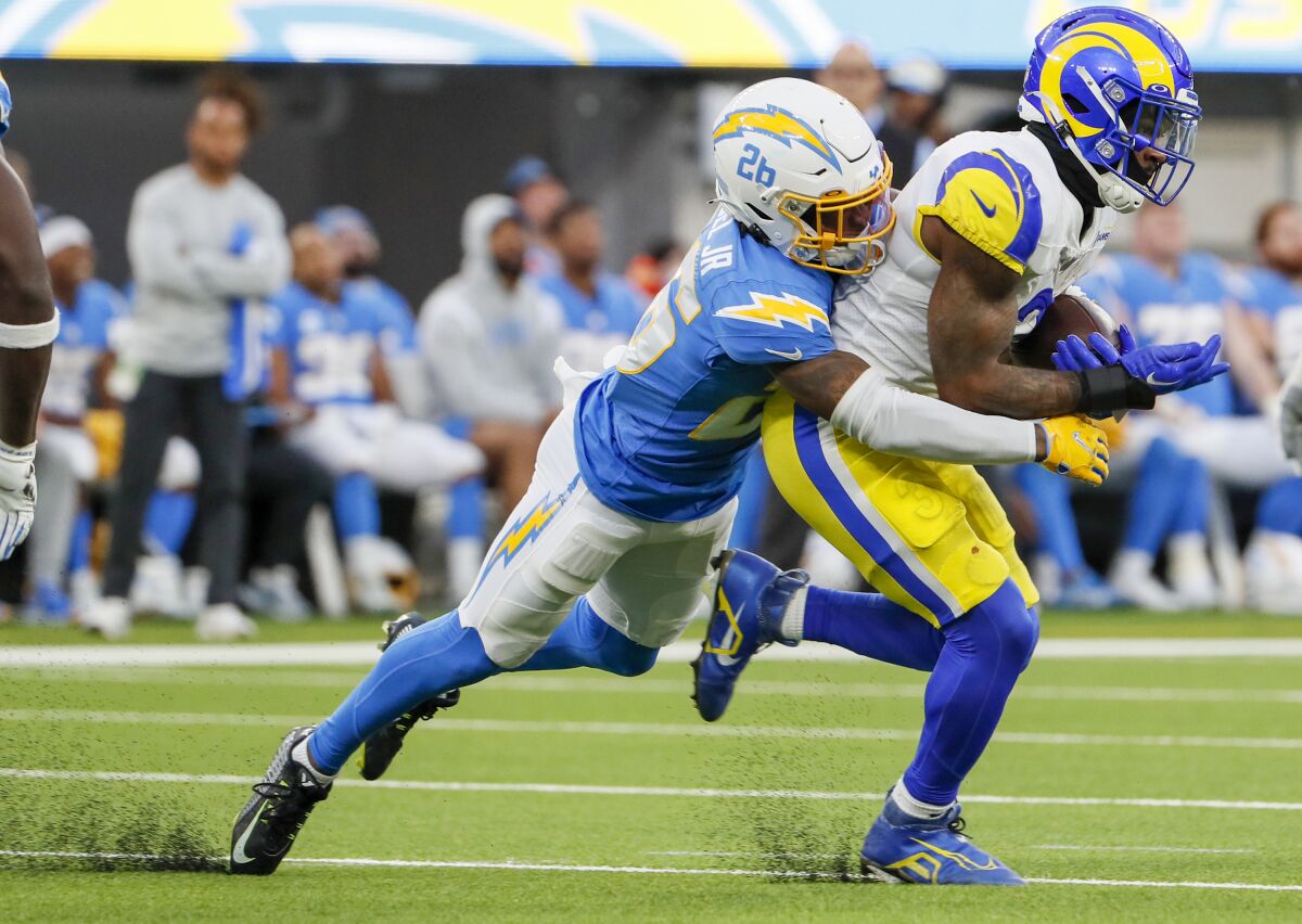  Rams running back Cam Akers (3) is tackled by Chargers cornerback Asante Samuel Jr. (26).