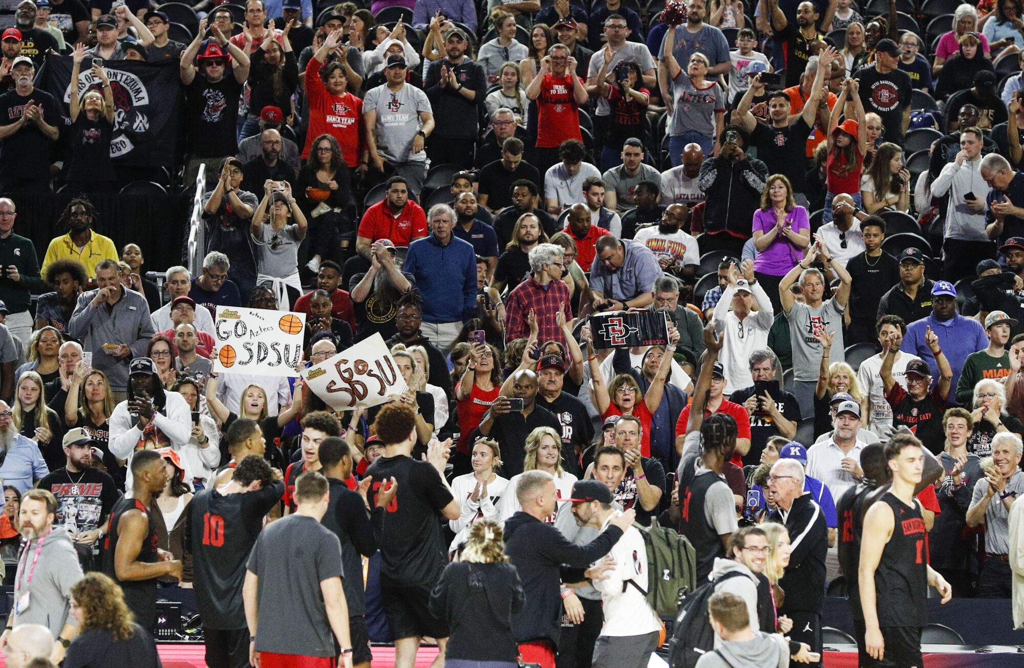 Fans cheer during San Diego State's practice leading up to the Final Four at the NRG Stadium.