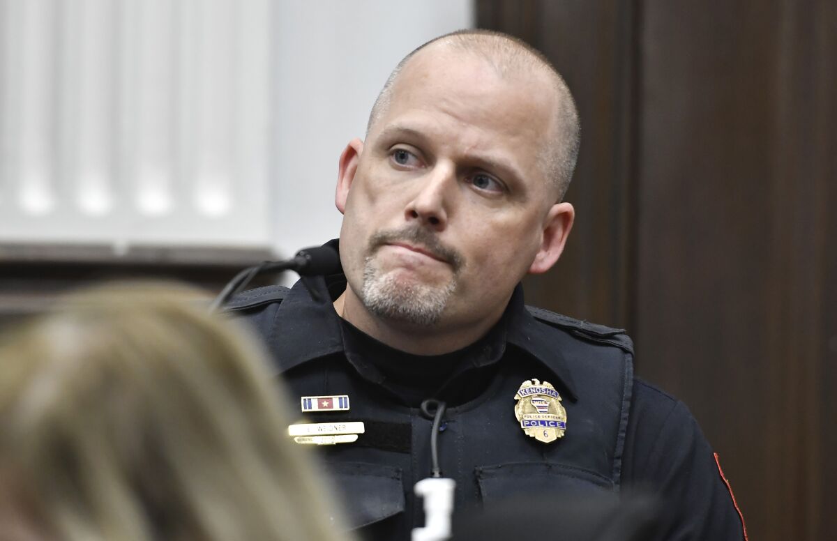 Kenosha Police Officer Erich Weidner testifies abut evidence he collected after the shooting on Aug. 25, 2020, during the trial of Kyle Rittenhouse at the Kenosha County Courthouse in Kenosha, Wis., on Friday, Nov. 5, 2021. Rittenhouse, an aspiring police officer, shot two people to death and wounded a third during a night of anti-racism protests in Kenosha in 2020. (Sean Krajacic/The Kenosha News via AP, Pool)