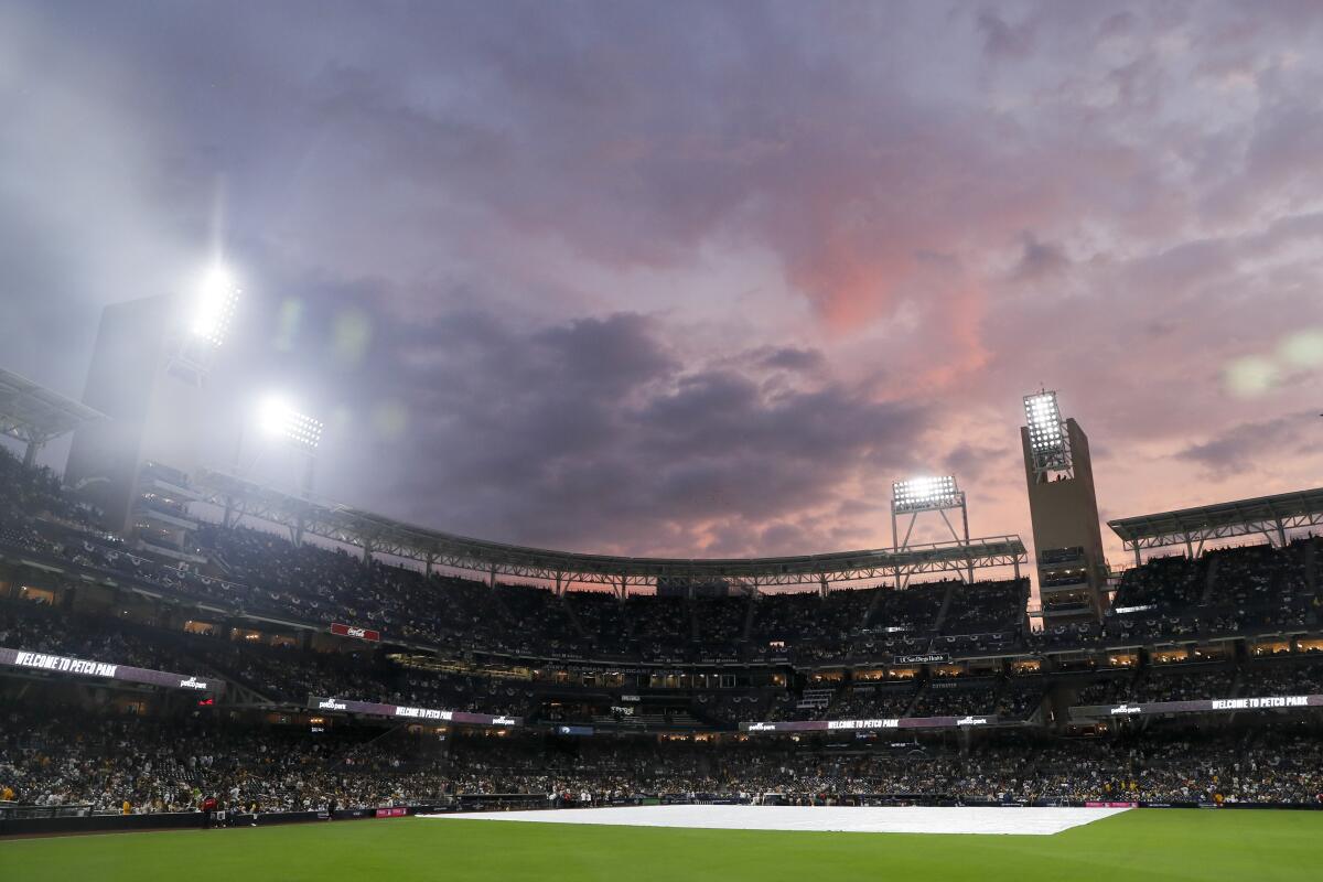 The sun sets behind Petco Park before the start of Game 4 of the NLDS.