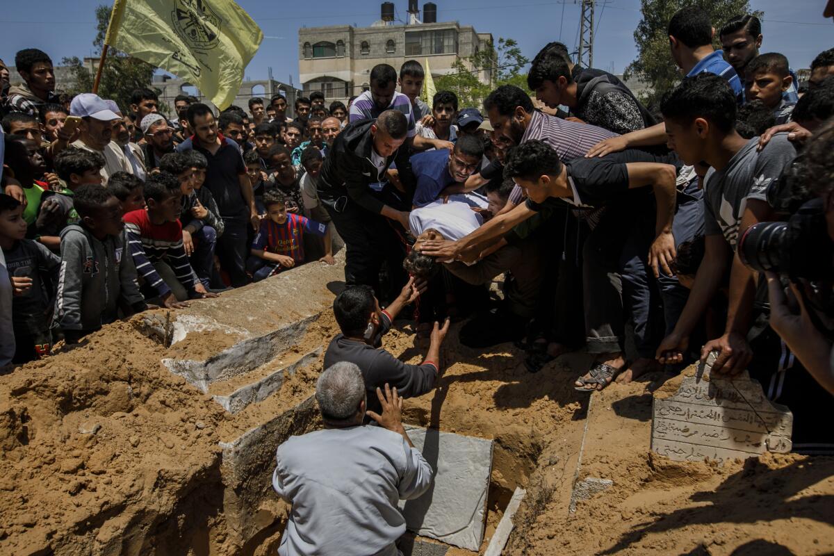 Mourners gather at a funeral service for Jamal Abdul-Rahman Affana, 15, who succumbed to his wounds sustained from last Friday's protest at the Israel-Gaza border fence in Rafah, Gaza.