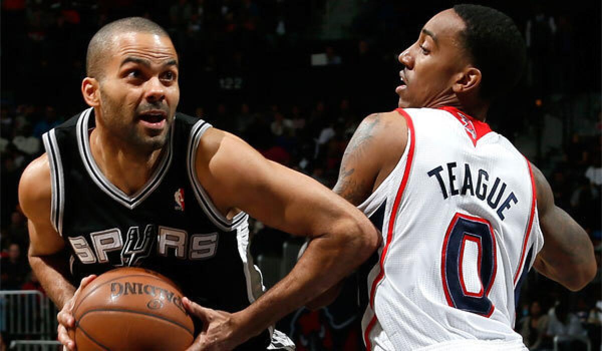 San Antonio's Tony Parker, shown driving past Atlanta's Jeff Teague earlier this season, has been battling injuries but produced 22 points and 10 assists in his most recent game.