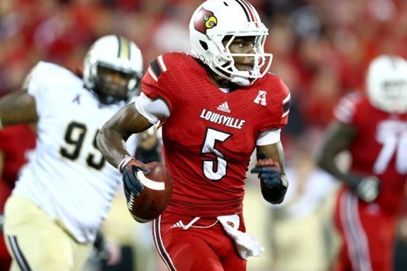 Louisville quarterback Teddy Bridgewater scrambles from Central Florida pressure during a game earlier this season.