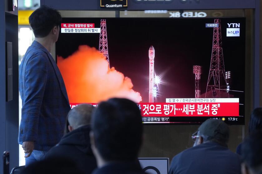 People watch a news program broadcasting file images of a rocket launch by North Korea, at the Seoul Railway Station in Seoul, South Korea, Tuesday, May 28, 2024. A rocket launched by North Korea to deploy the country's second spy satellite exploded shortly after liftoff Monday, state media reported, in a setback for leader Kim Jong Un's hopes to field satellites to monitor the U.S. and South Korea. (AP Photo/Ahn Young-joon)