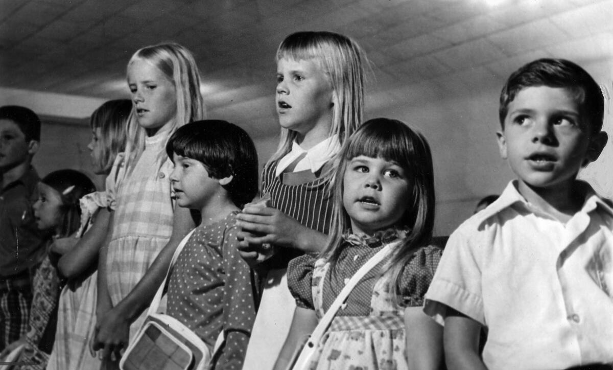 July 17, 1976: Sandy Zylstra, 7, third from right, was the last child to get off the school bus before kidnappers seized 26 Chowchilla children. She and Sunday school classmates sing at church during a celebration of the rescue.