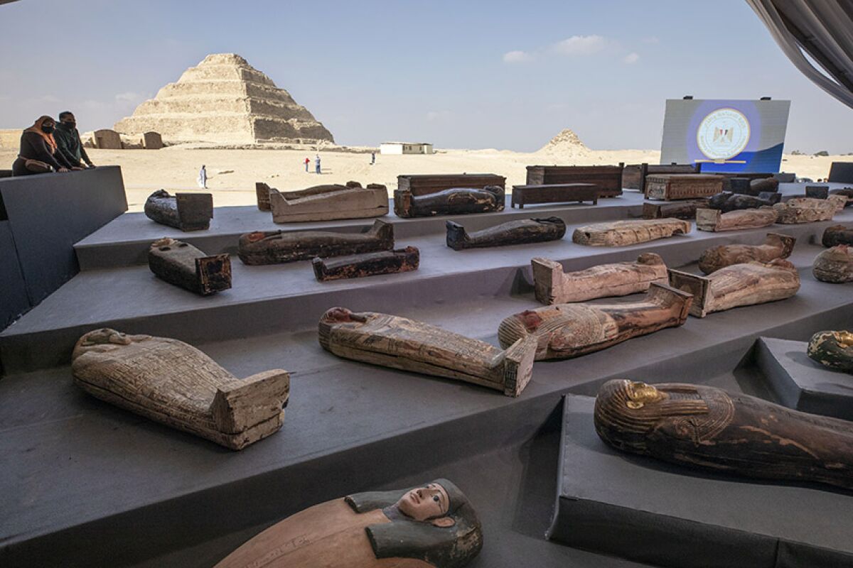 Ancient sarcophagi are displayed at a necropolis south of Cairo on Saturday.