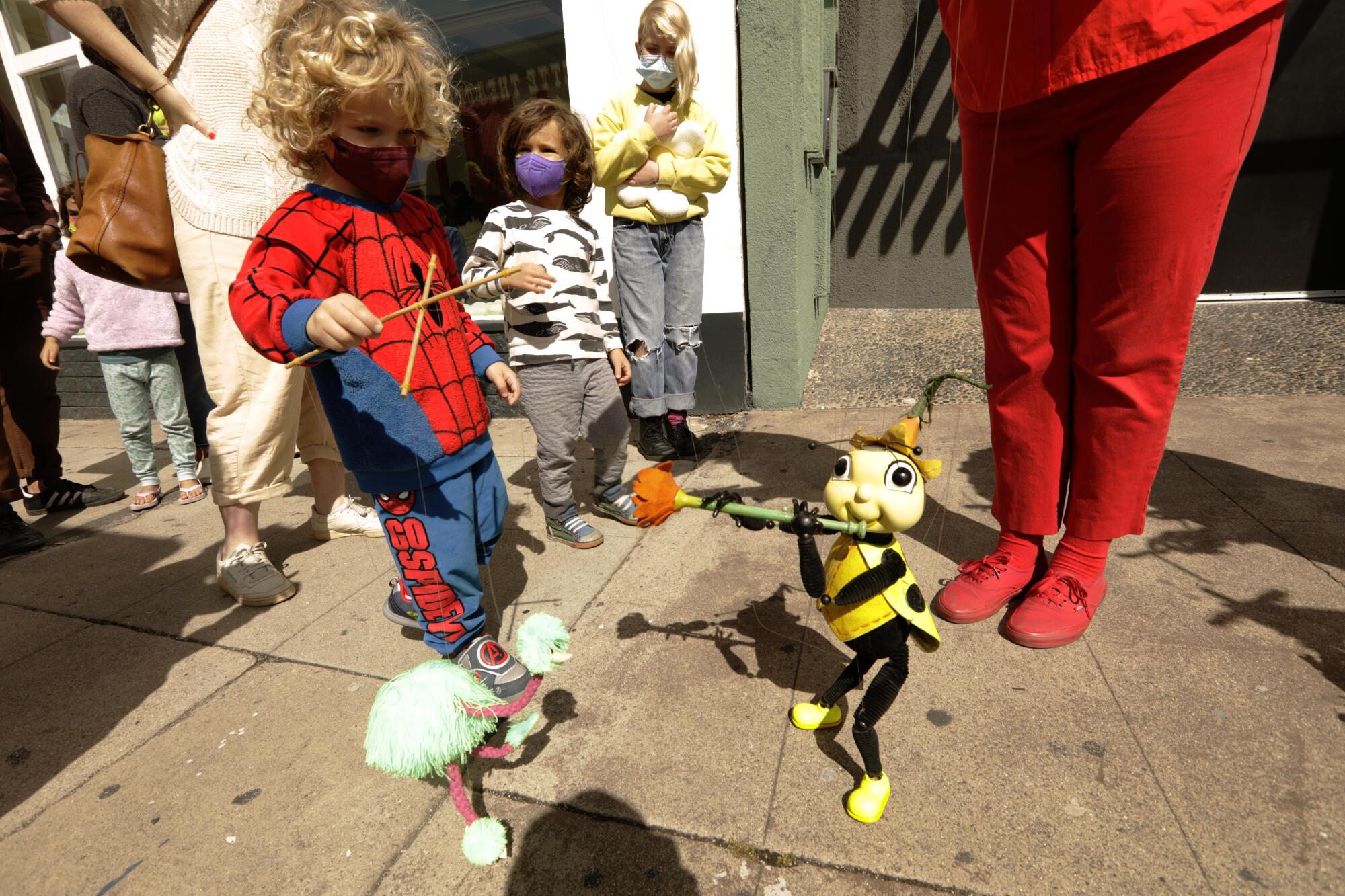 Bob Baker Marionette Theater puppeteer Karina De La Cruz operates a ladybug puppet 