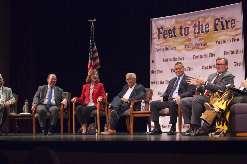 Costa Mesa City Council candidates, from left, Jay Humphrey, John Stephens, Councilwoman Sandy Genis, Lee Ramos, Allan Mansoor and Mayor Steve Mensinger with hosts Tom Johnson, former Daily Pilot publisher, and Barbara Venezia, Daily Pilot columnist, at a Feet to the Fire Forum Aug. 18 at Orange Coast College in Costa Mesa.