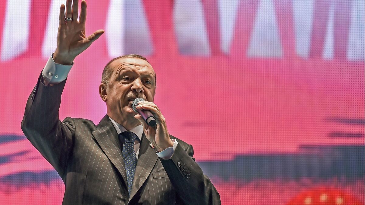 Turkish President Recep Tayyip Erdogan delivers a speech at a July 15, 2018, ceremony marking the two years since a failed coup against him.