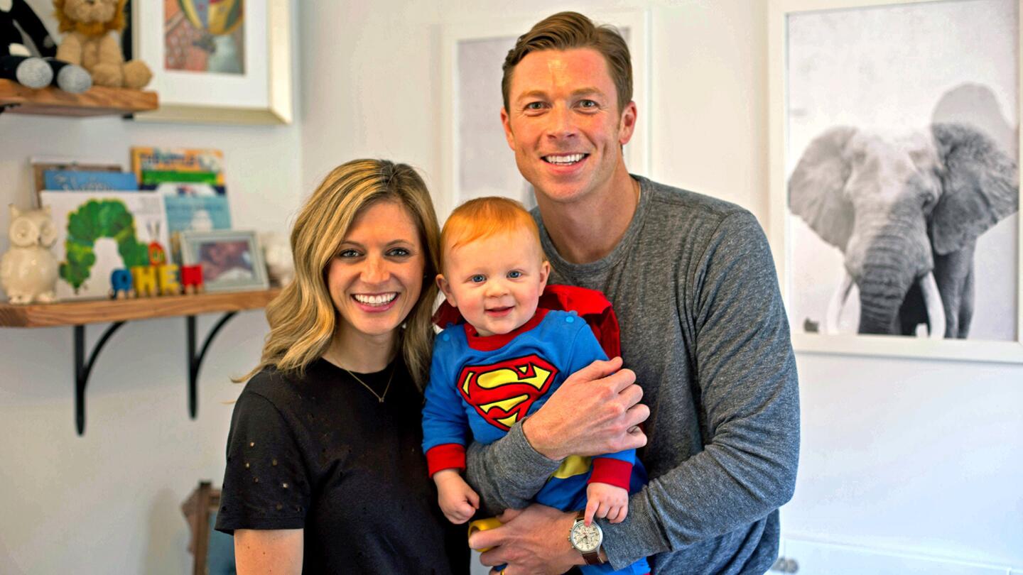 Sam Daly with his wife, Marissa, and their son Owen, in the nursery. The actor wanted a place where the trio could "sprawl out on the floor and make a mess and grow up together."