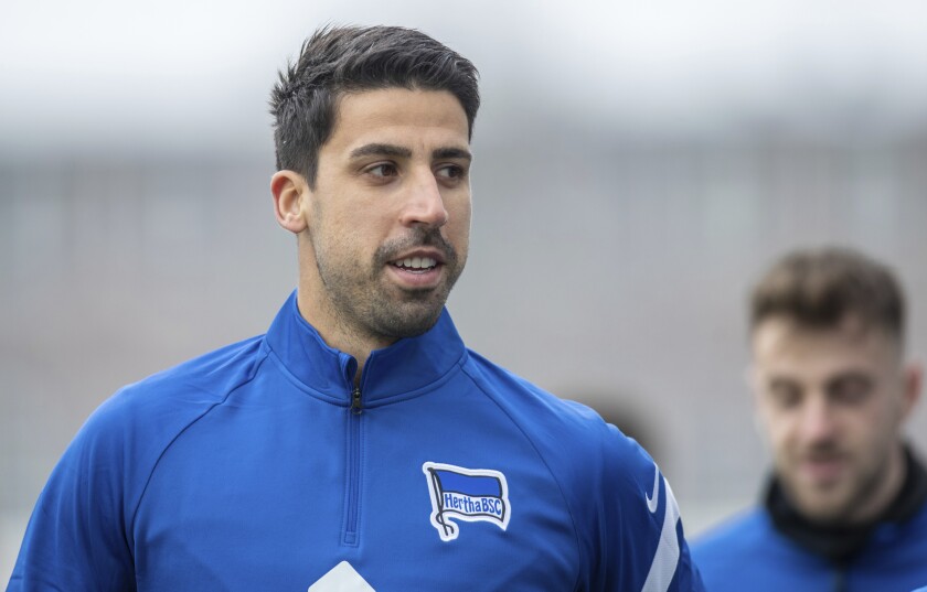 Soccer player Sami Khedira attends his first training session with German Bundesliga soccer club Hertha BSC Berlin in Berlin, Germany, Tuesday, Feb. 2, 2021. The player moves from Italy's Juventus Turin to Berlin. (Andreas Gora/dpa via AP)