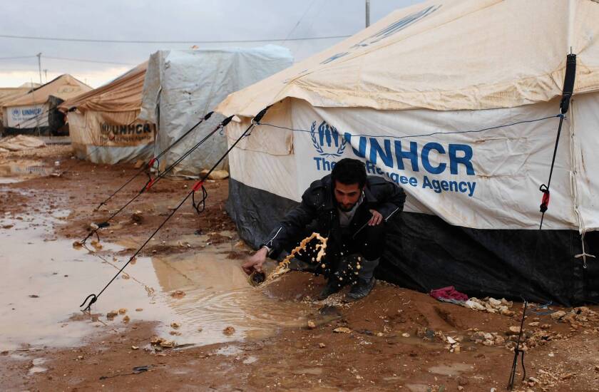 A Syrian refugee is among those whose tents were flooded at the Zaatari camp in Jordan.