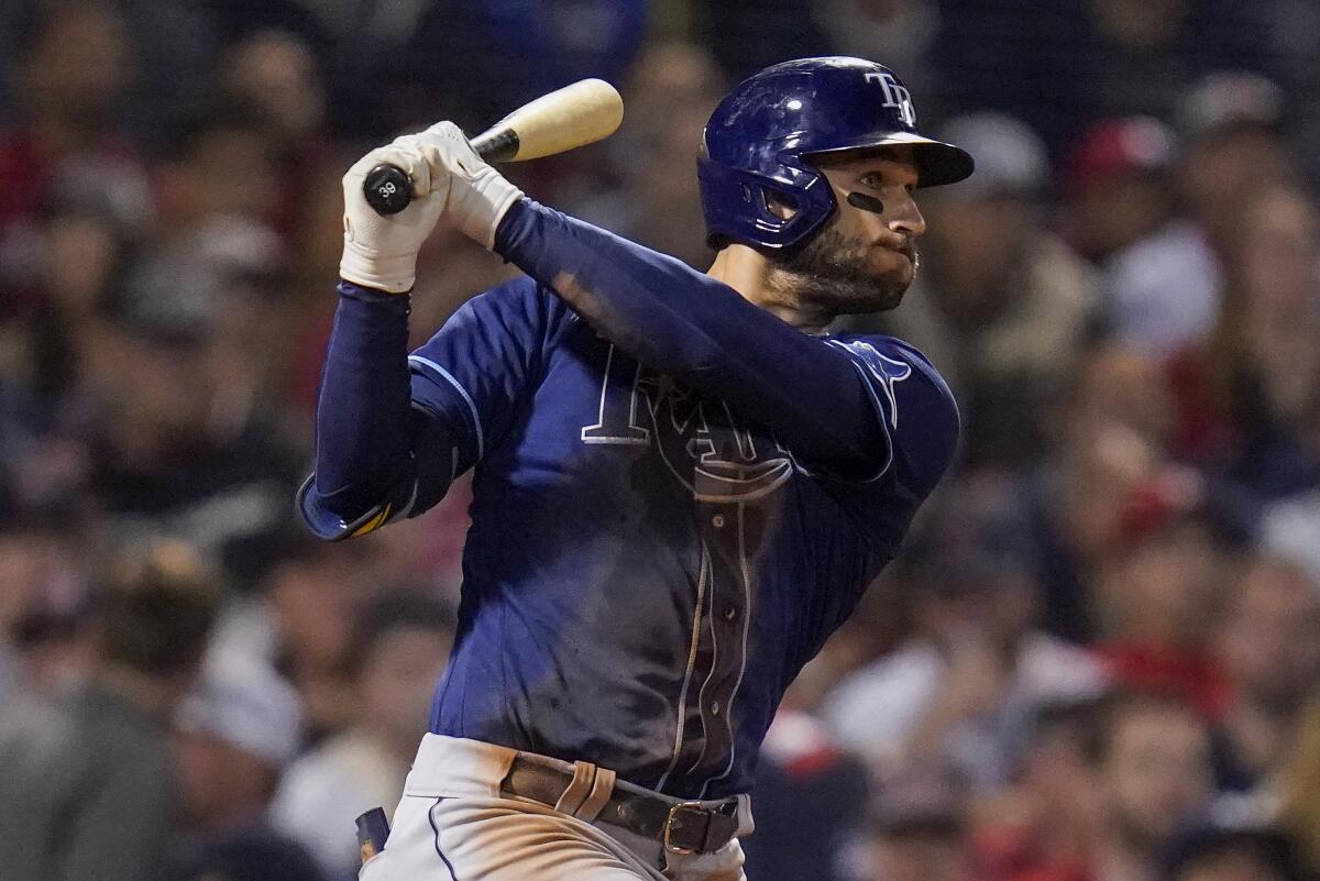 Tampa Bay Rays Kevin Kiermaier follows through on a double during the eighth inning against the Boston Red Sox during Game 4 of a baseball American League Division Series, Monday, Oct. 11, 2021, in Boston. (AP Photo/Charles Krupa)