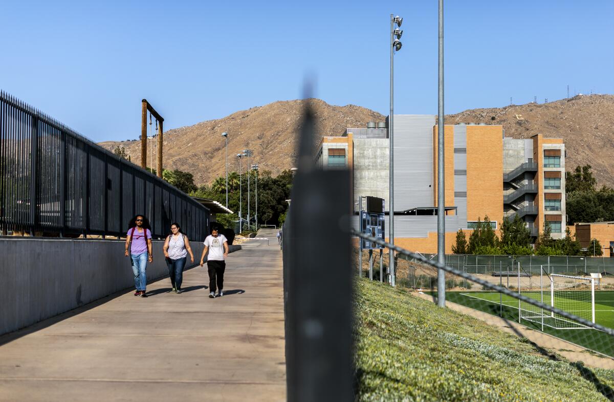 Students walk on the UC Riverside campus on July 15.
