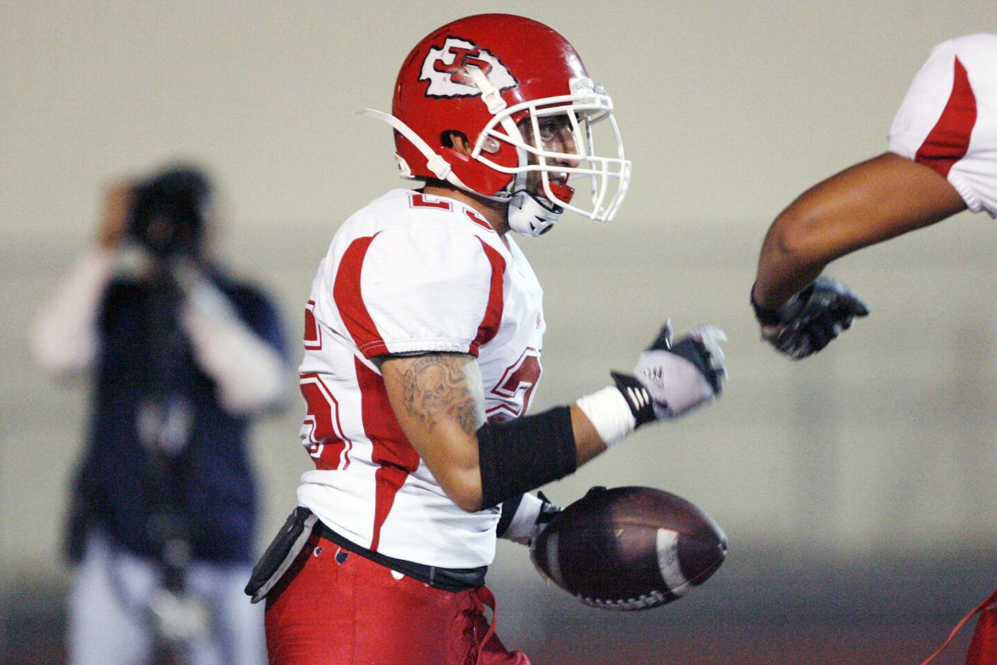 Burroughs' Israel Montes bumps fists with Victor Mora during a game against CV at Glendale High School on Thursday, October 4, 2012.