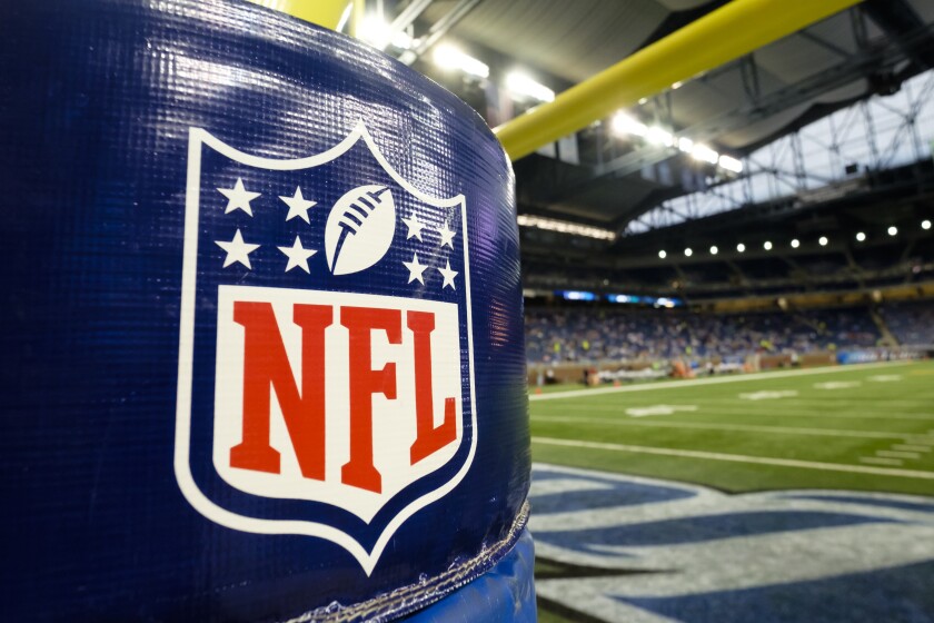 FILE - In this Thursday, Aug. 13, 2015 file photo, NFL Logo is seen on the goal post padding before an NFL preseason football game between the Detroit Lions and the New York Jets at Ford Field in Detroit. The process of building the NFL schedule used to be a painstaking one with executives like Val Pinchbeck spending months slotting the games one by one on his board until there was a final product for the commissioner to approve. Making late tweaks or looking at alternative options with a big game moving from early to late in the season weren't really possible for all the pieces of the complicated jigsaw puzzle to fit.(AP Photo/Rick Osentoski, File)