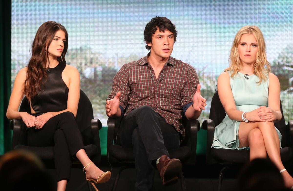 PASADENA, CA - JANUARY 15: (L-R) Actors Marie Avgeropoulos, Bob Morley and Eliza Taylor of the television show "The 100" speak onstage during the CW portion of the 2014 Winter TCA tour at the Langham Hotel on January 15, 2014 in Pasadena, California. (Photo by Frederick M. Brown/Getty Images) ** OUTS - ELSENT, FPG, TCN - OUTS * NM, PH, VA if sourced by CT, LA or MoD **