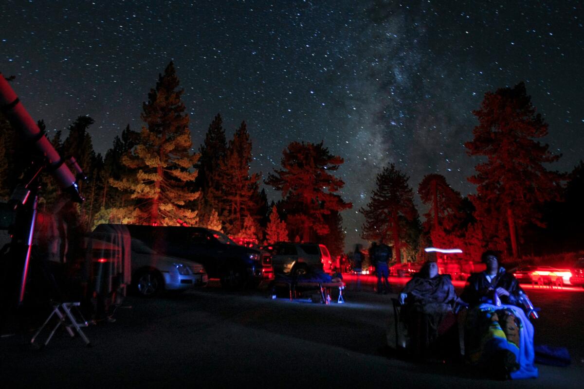 Stargazers sit beneath the Milky Way at Mt. Pinos in 2010.