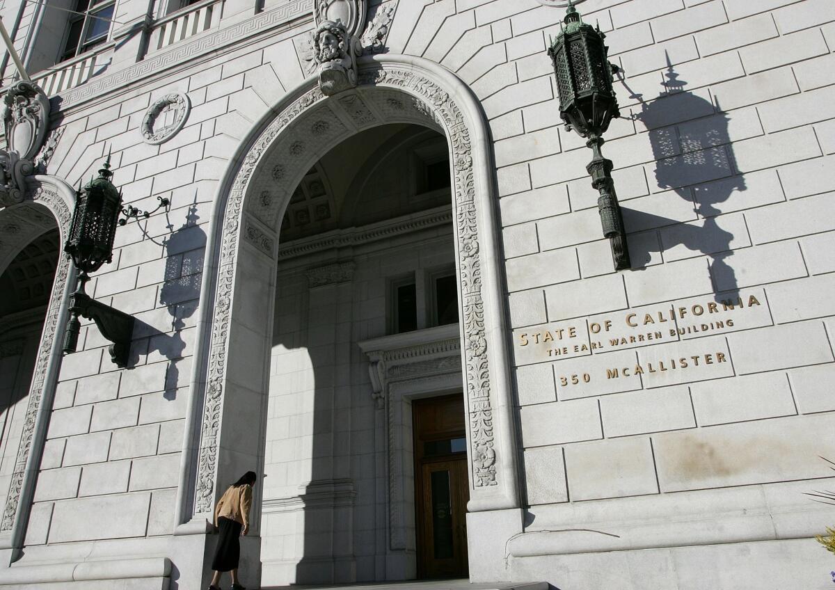 SAN FRANCISCO - JANUARY 22: A woman walks into the State of California Earl Warren building January 22, 2007 in San Francisco, California. The U.S. Supreme court threw out California's sentencing law on Monday, a decision that could reduce sentences for thousands of inmates in the California State correctional facilities. (Photo by Justin Sullivan/Getty Images) ** OUTS - ELSENT, FPG, CM - OUTS * NM, PH, VA if sourced by CT, LA or MoD **