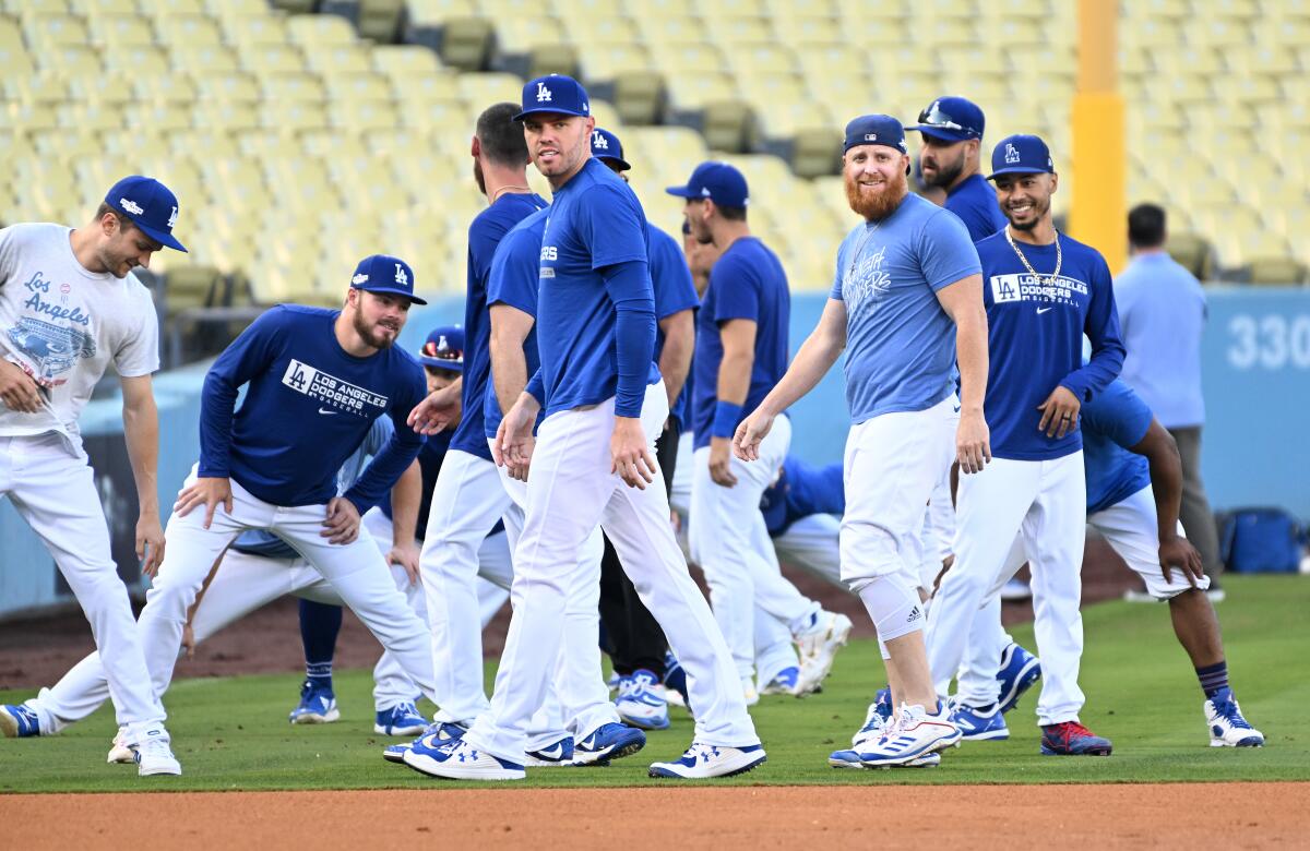 Dodgers players work out a day before the start of the NLDS at Dodger Stadium.