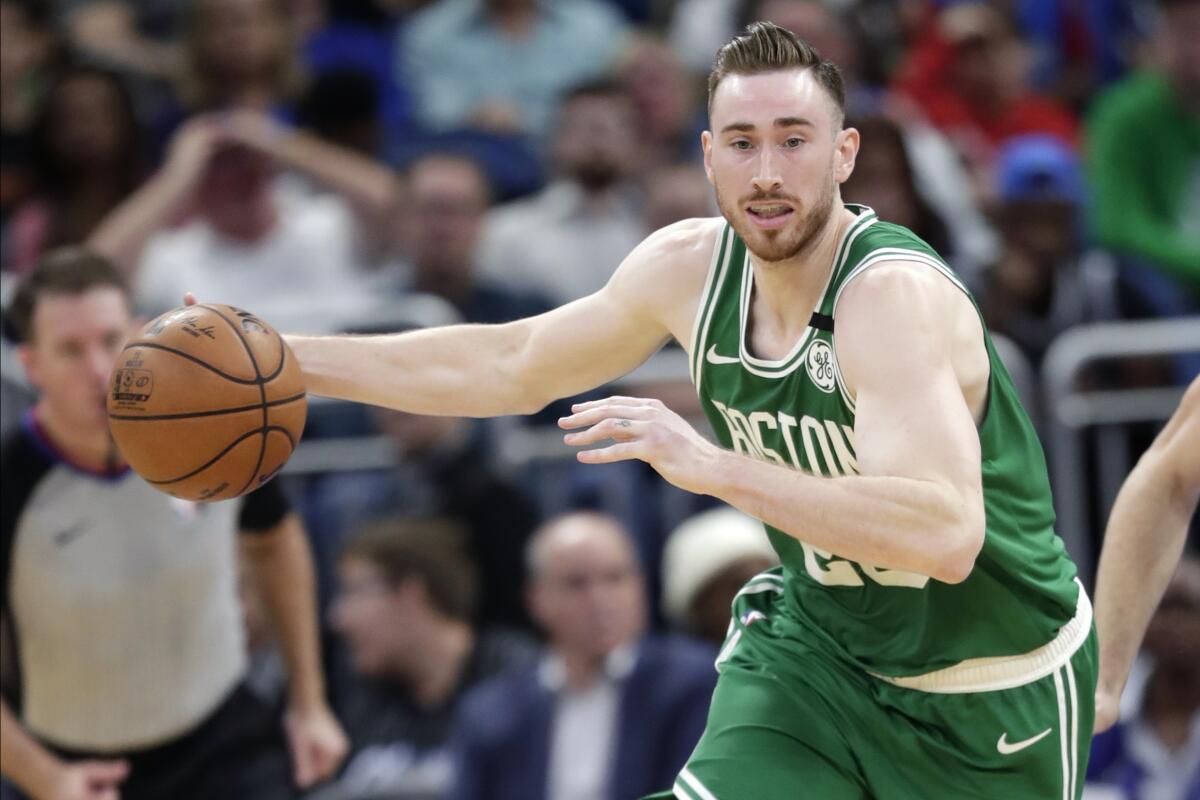 FILE - In this Jan. 24, 2020, file photo, Boston Celtics forward Gordon Hayward moves the ball on a fast break against the Orlando Magic during the second half of an NBA basketball game in Orlando, Fla. Hayward has been a player that the Charlotte Hornets have wanted for years. On Saturday, Nov. 21, 2020, they finally landed him, according to Priority Sports, the agency that represents the veteran forward. ESPN, which first reported the agreement, said Hayward would sign a four-year deal worth $120 million. (AP Photo/John Raoux, File)