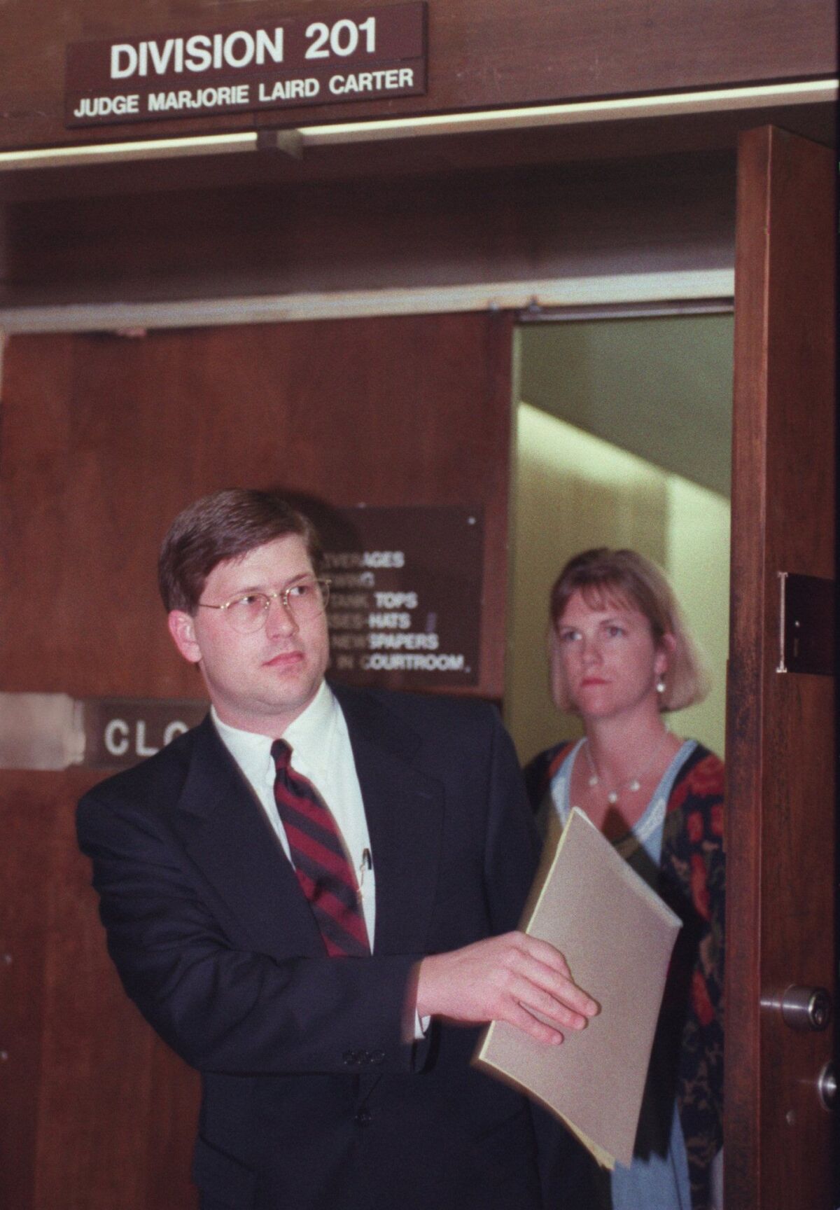 In this file photo from 1996, Mark Denny leaves an Orange County courtroom after pleading guilty to election fraud.