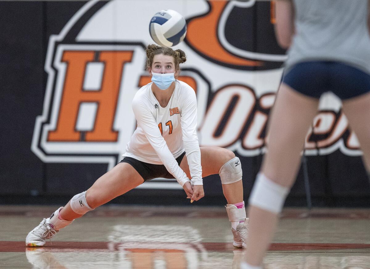 Huntington Beach's Haylee LaFontaine passes a ball against Newport Harbor on Tuesday.