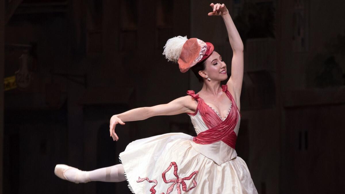 Isabella Boylston as Columbine in Act 1, with her jaunty hat.