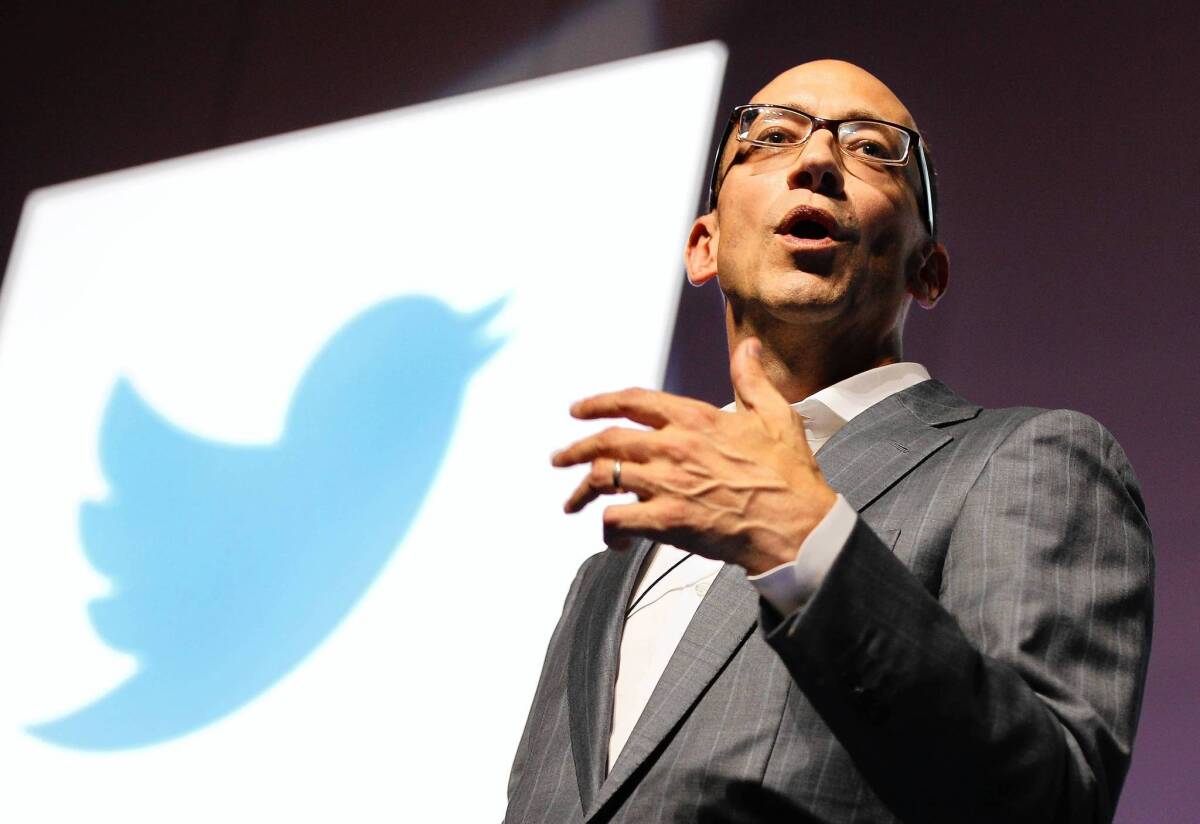 Twitter CEO Dick Costolo is shown with the company's logo, a blue bird, during a seminar in Cannes, France.