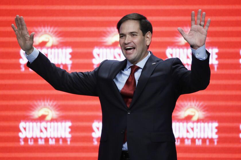Republican presidential candidate Marco Rubio waves to the audience at the conclusion of his remarks at the Sunshine Summit in Orlando, Fla., on Nov. 13.