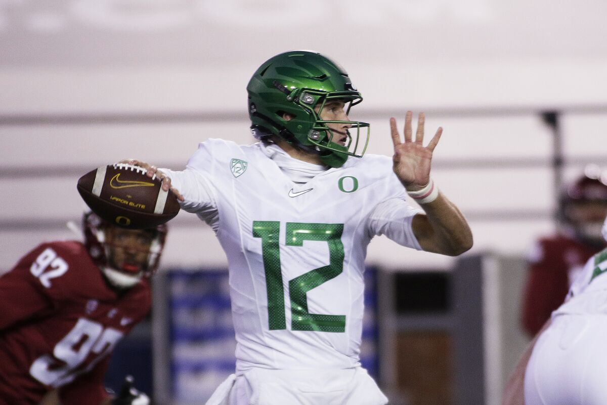 Oregon quarterback Tyler Shough passes against Washington State on Nov. 14, 2020.