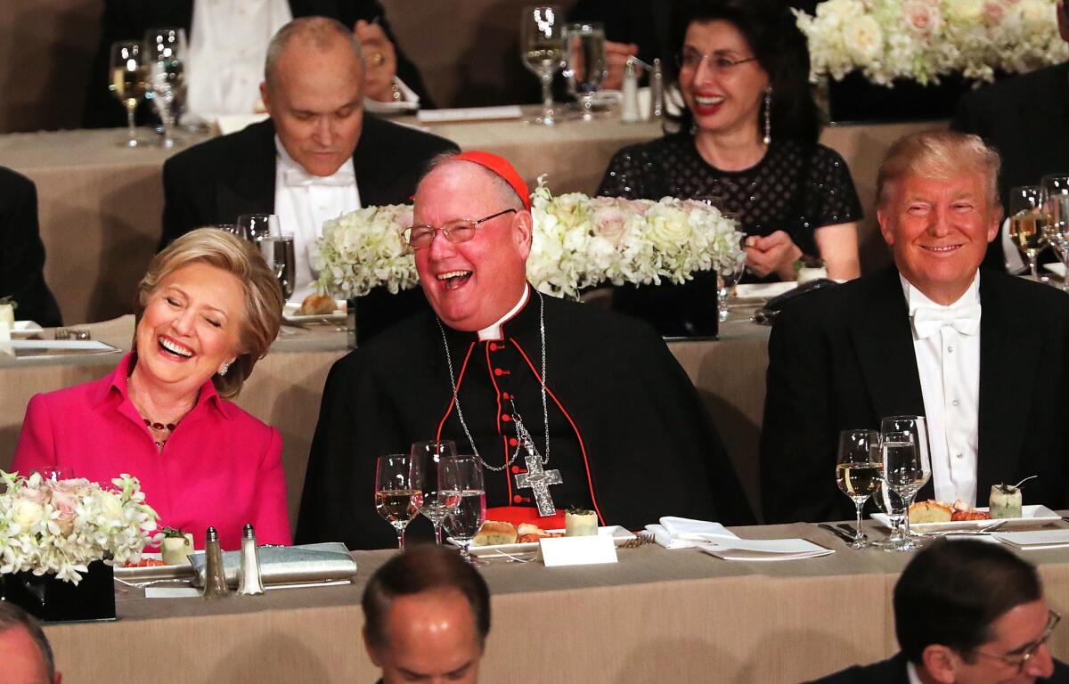 Hillary Clinton and Donald Trump had only Cardinal Timothy Dolan separating them at the annual Alfred E. Smith Memorial Foundation Dinner in New York.