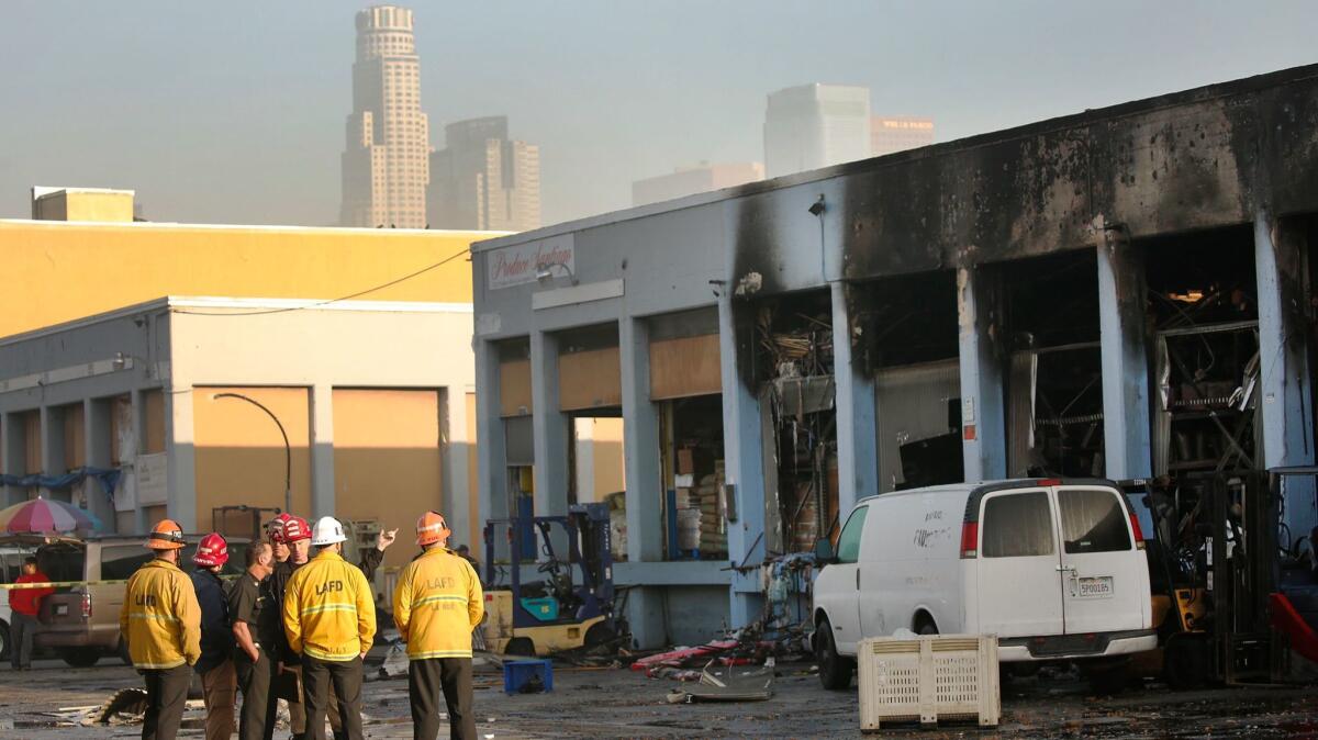 Los Angeles city fire captains and arson investigators are on the scene of a massive blaze at a wholesale building at 817 S. Central Ave.