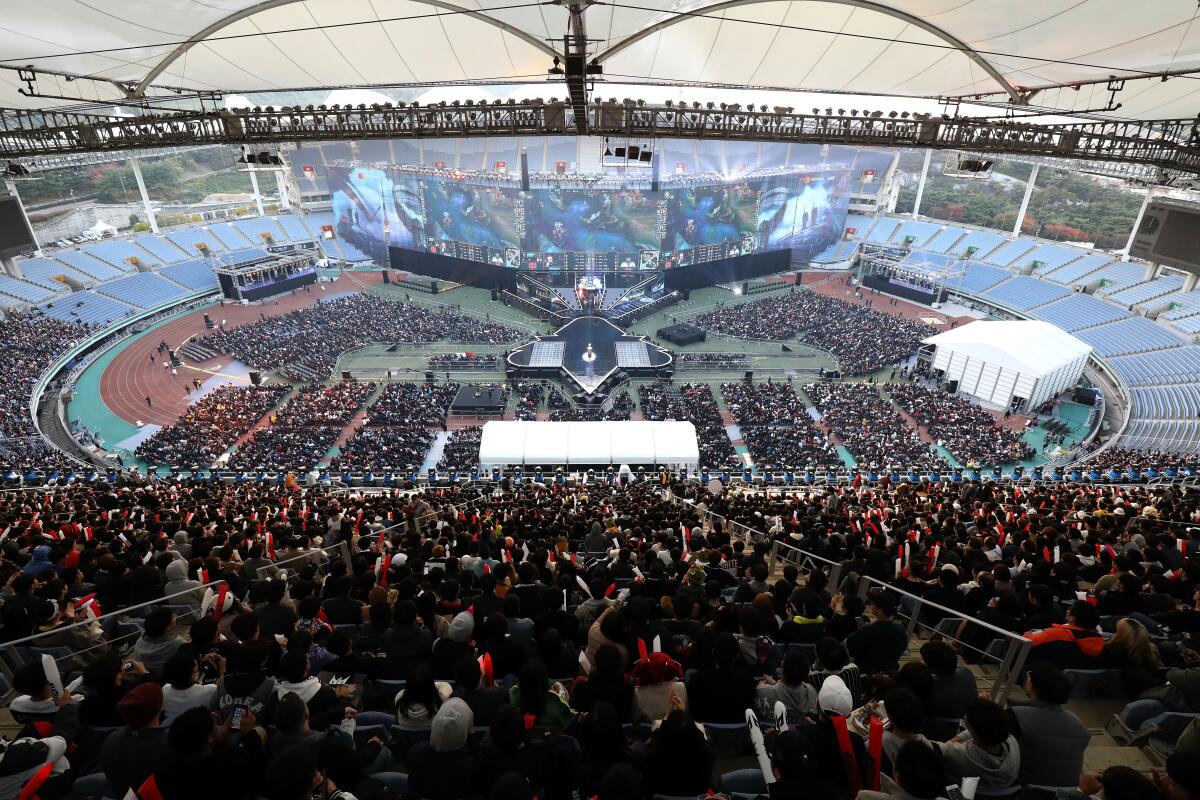 Fans watch the finals match of the 2018 League of Legends World Championship at Incheon Munhak Stadium on Nov. 3, 2018. Industry advocates warn that recognizing game addiction as a disorder could cripple the country's lucrative gaming sector.