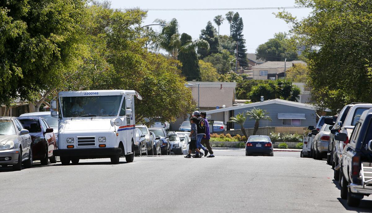 Vehicles parked along Queens Lane in the Oak View neighborhood of Huntington Beach.