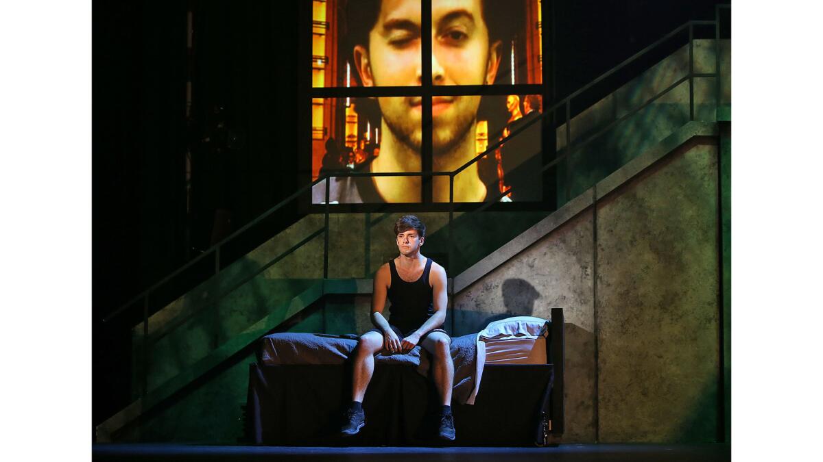 A cast member prepares for a scene during rehearsal of "American Idiot" at UCI's Claire Trevor Theater.