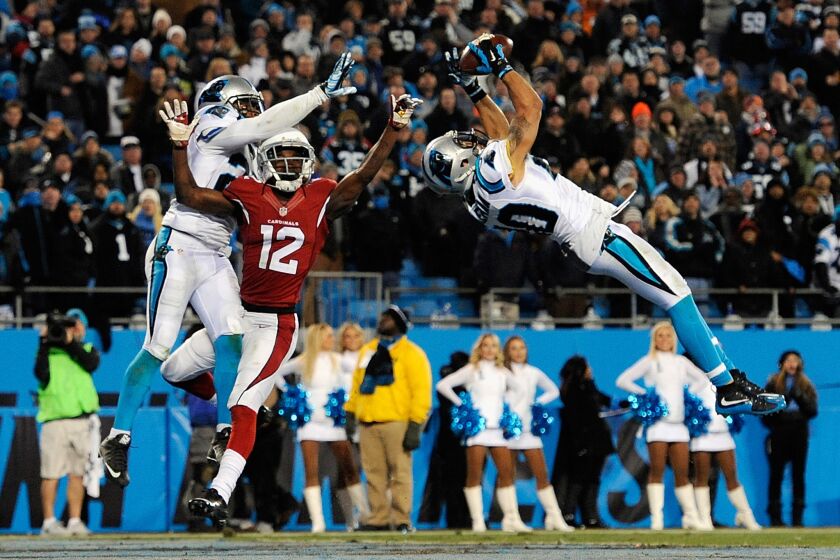 Panthers safety Kurt Coleman intercepts a pass intended for Cardinals receiver John Brown during the second half of the NFC Championship game on Jan. 24.