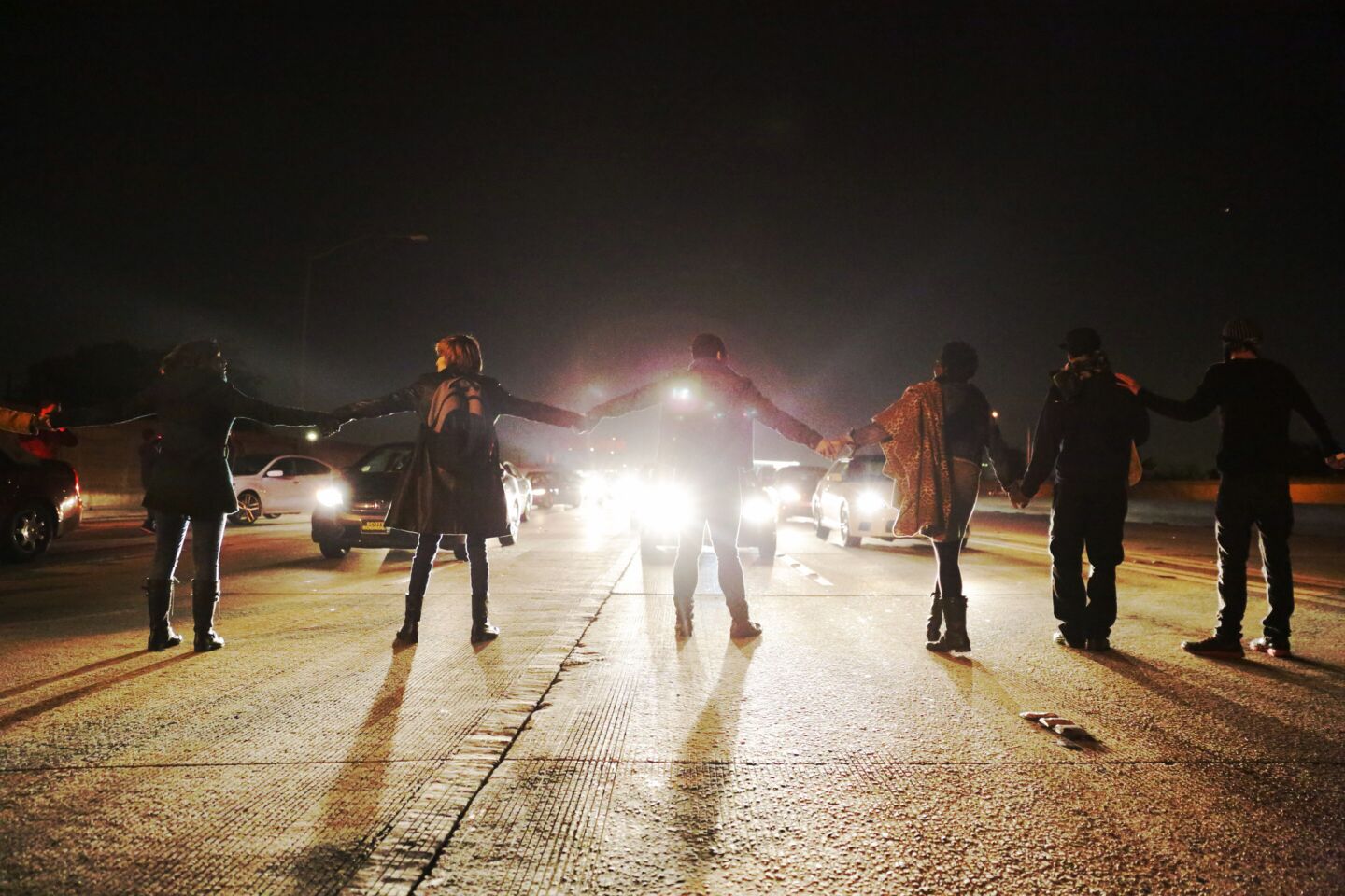 Demonstrators block the southbound 110 Freeway, protesting in the wake of the Ezell Ford's autopsy released in Los Angeles.