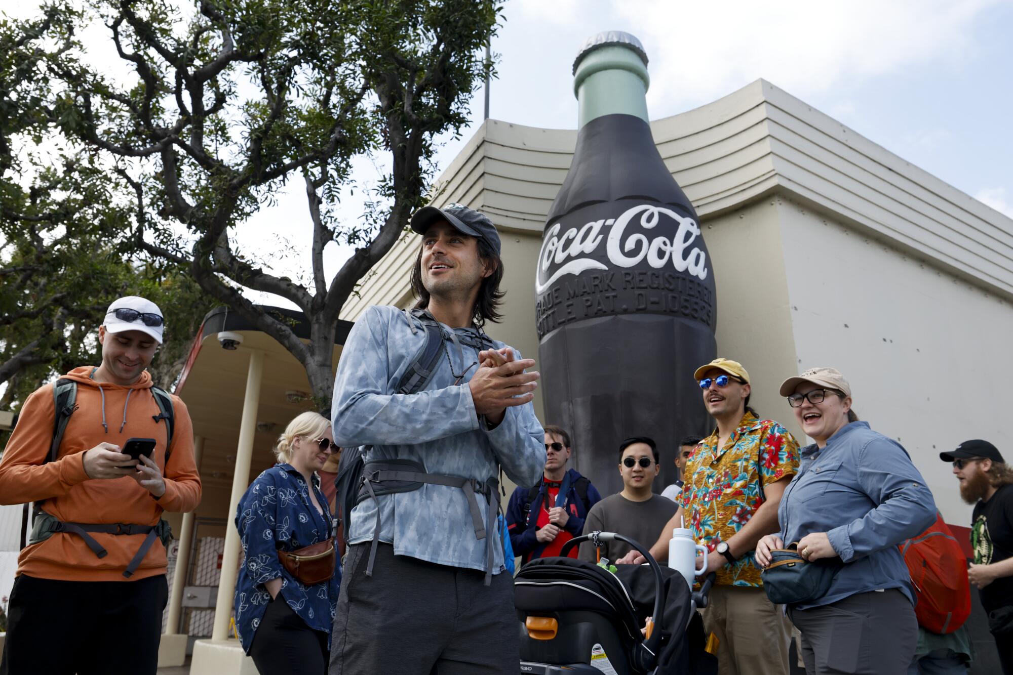 Pedro Moura and a group of walkers gather at the eastern terminus of Pico Boulevard, ready to begin their daylong walk.