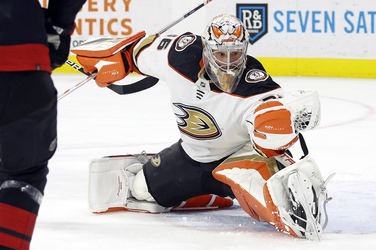 Ducks goalie John Gibson stops a shot against the Carolina Hurricanes on Feb. 25, 2023.